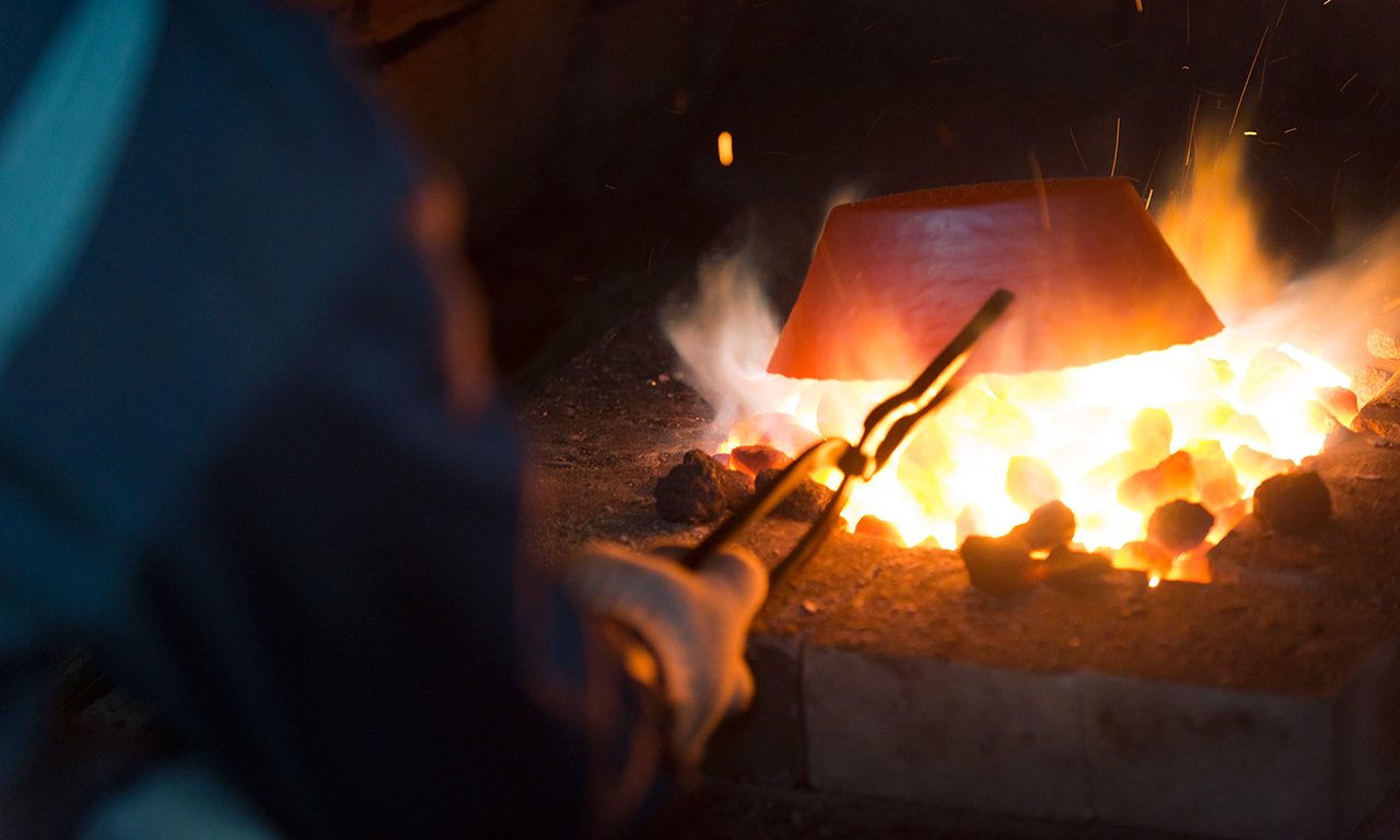 Making metal handicraft at a blacksmith workshop in Tsubame-Sanjo